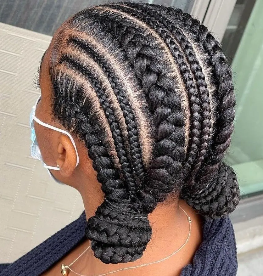 Stitch braids finished in a low bun